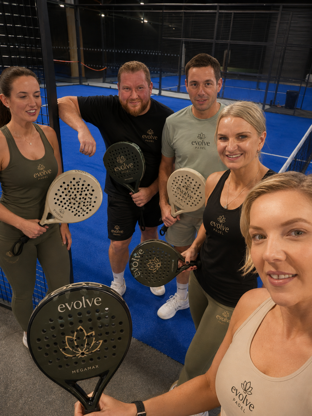 ev0lve padel team in branded apparel on court